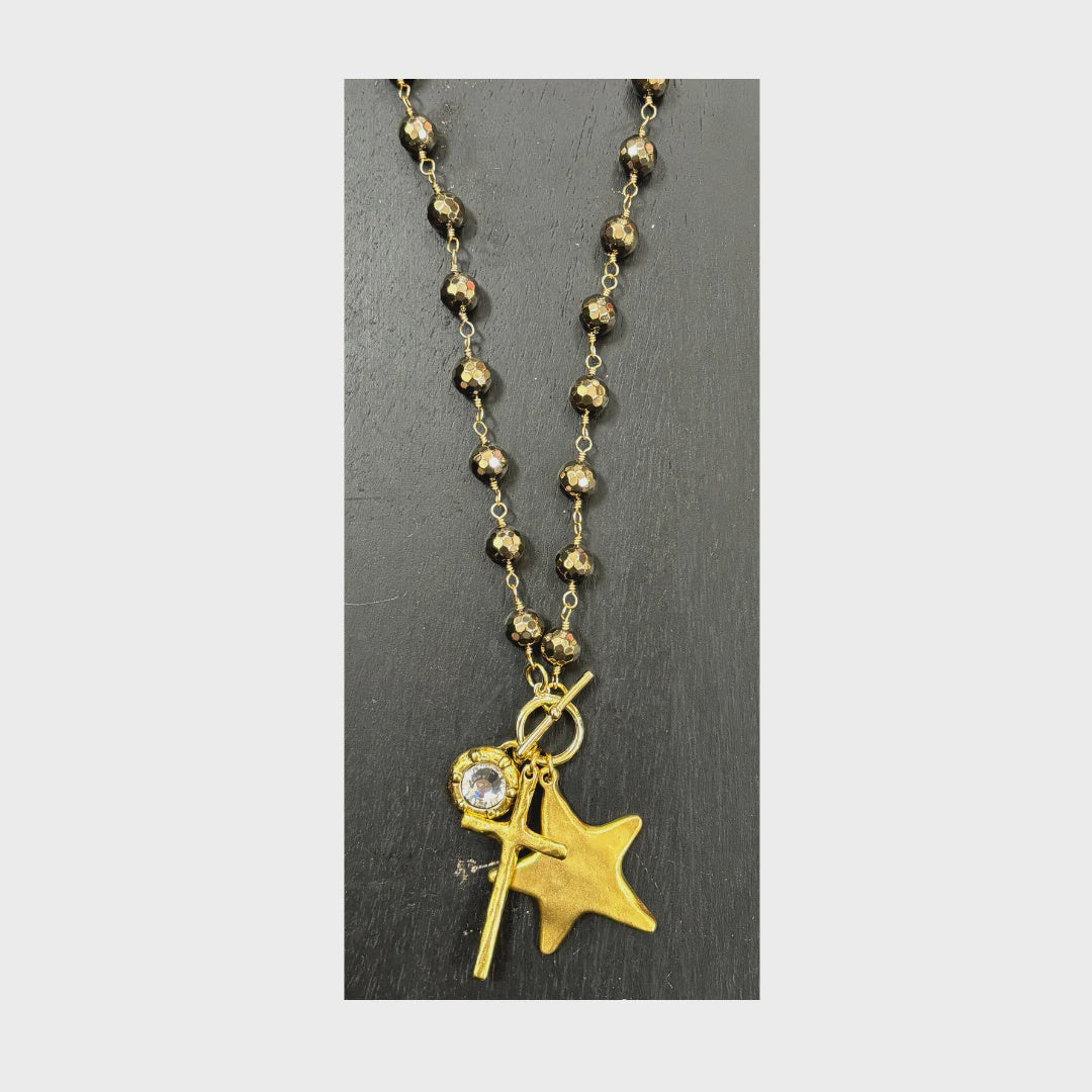 17" wrapped pyrite necklace with front toggle and antique gold charms